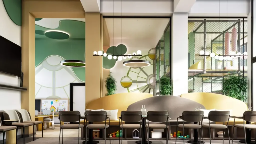 Elegantno opremljen prostor za druženje roditelja sa udobnim klupama i stlolicama. Na zidu je veliki TV sa video nadzorom igraonice da pratite tokom rođendana.