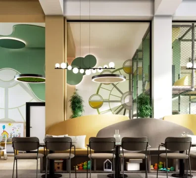 Elegantno opremljen prostor za druženje roditelja sa udobnim klupama i stlolicama. Na zidu je veliki TV sa video nadzorom igraonice da pratite tokom rođendana.